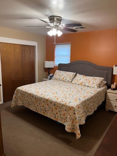 622 North 14th Street Memphis, TX 79245 - Photo 15 of 29 a bed sitting in a bedroom next to a lamp