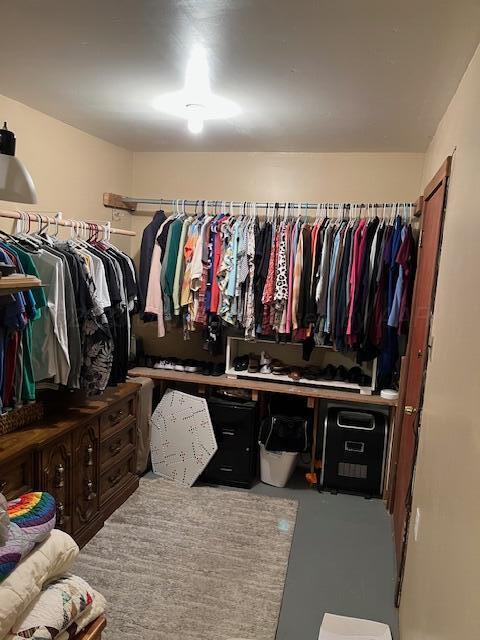 622 North 14th Street Memphis, TX 79245 - Photo 17 of 29 a view of walk in closet with clothes and shoes