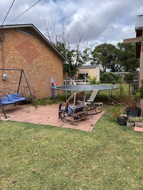 622 North 14th Street Memphis, TX 79245 - Photo 21 of 29 a view of a backyard with sitting area