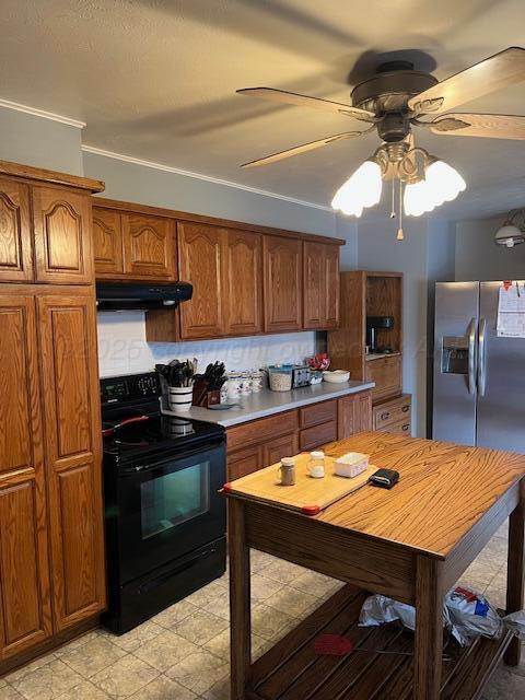 622 North 14th Street Memphis, TX 79245 - Photo 26 of 29 a kitchen with stainless steel appliances granite countertop a stove refrigerator and cabinets