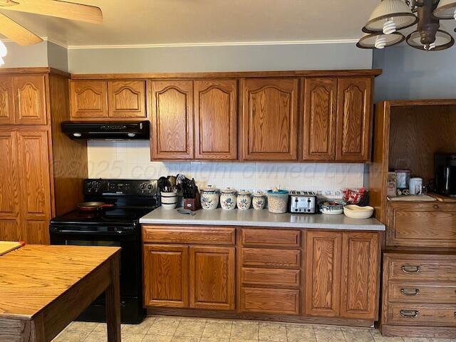 622 North 14th Street Memphis, TX 79245 - Photo 29 of 29 a kitchen with stainless steel appliances granite countertop a stove top oven a sink dishwasher and cabinets with wooden floor