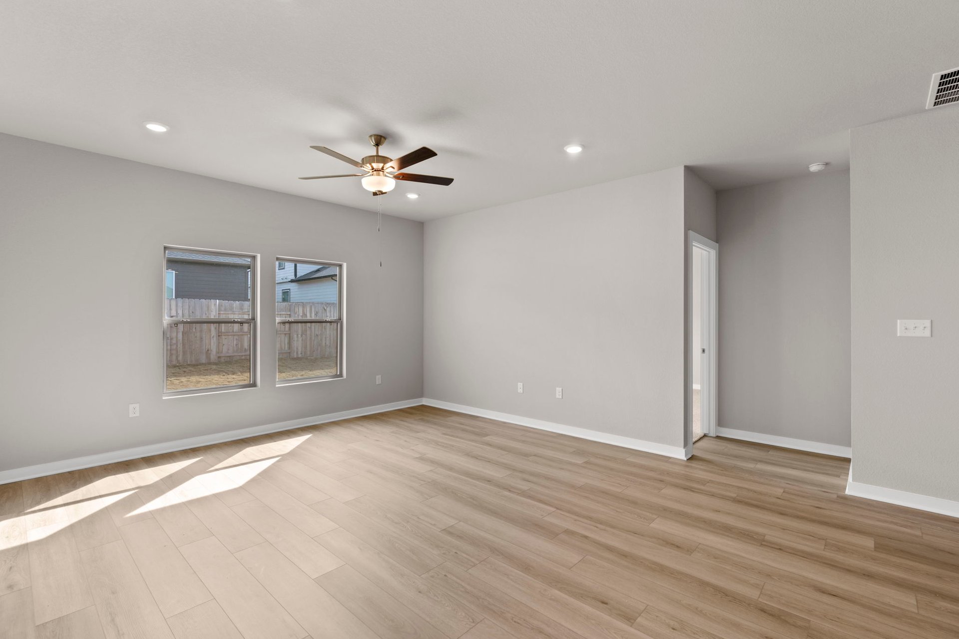 13621 Gray Landing Drive Elgin, TX 78621 - Photo 16 of 36 wooden floor in an empty room with a window