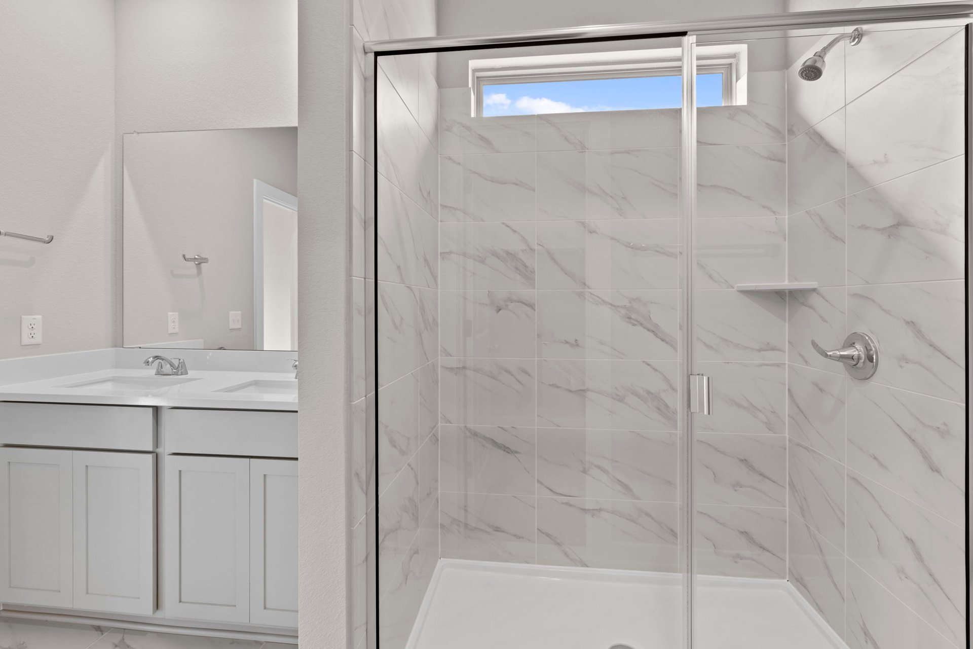 13621 Gray Landing Drive Elgin, TX 78621 - Photo 22 of 36 a bathroom with a shower and a sink