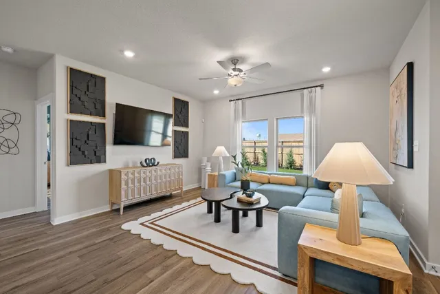 a living room with furniture and kitchen view