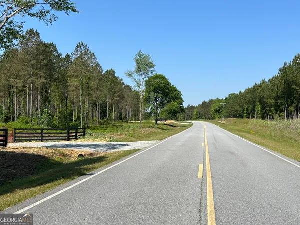 a view of a swimming pool and a yard