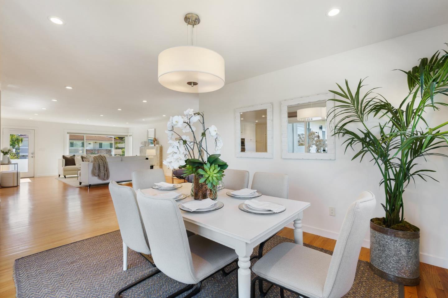 1150 Elmwood Drive Millbrae, CA 94030 - Photo 13 of 46 a view of a dining room with furniture and wooden floor