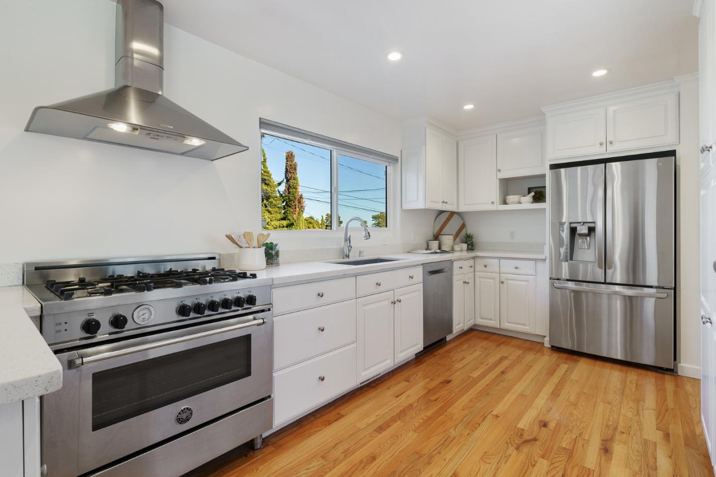 1150 Elmwood Drive Millbrae, CA 94030 - Photo 15 of 46 a kitchen with a stove a refrigerator and a sink