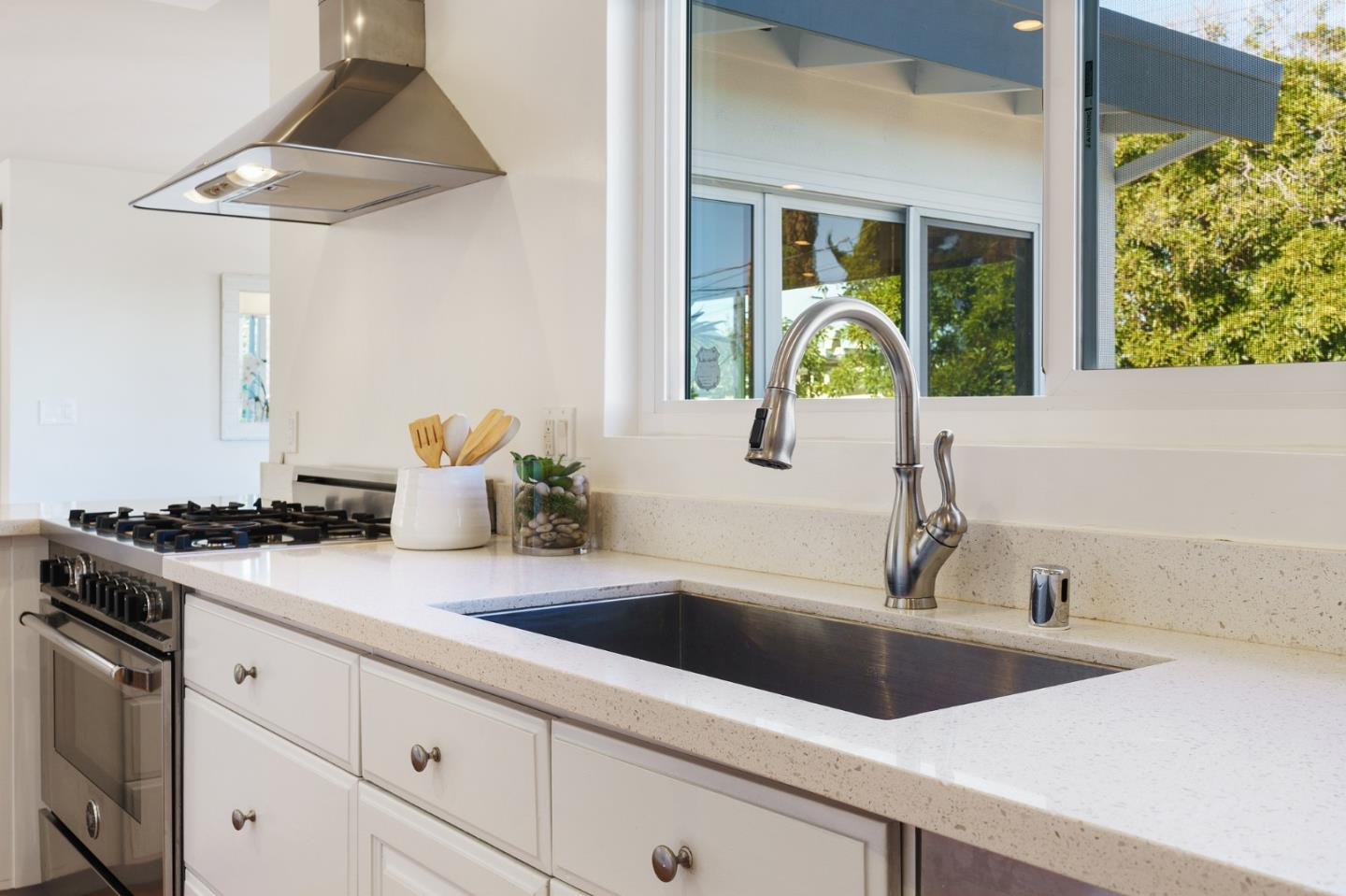 1150 Elmwood Drive Millbrae, CA 94030 - Photo 16 of 46 a kitchen with a sink and a stove