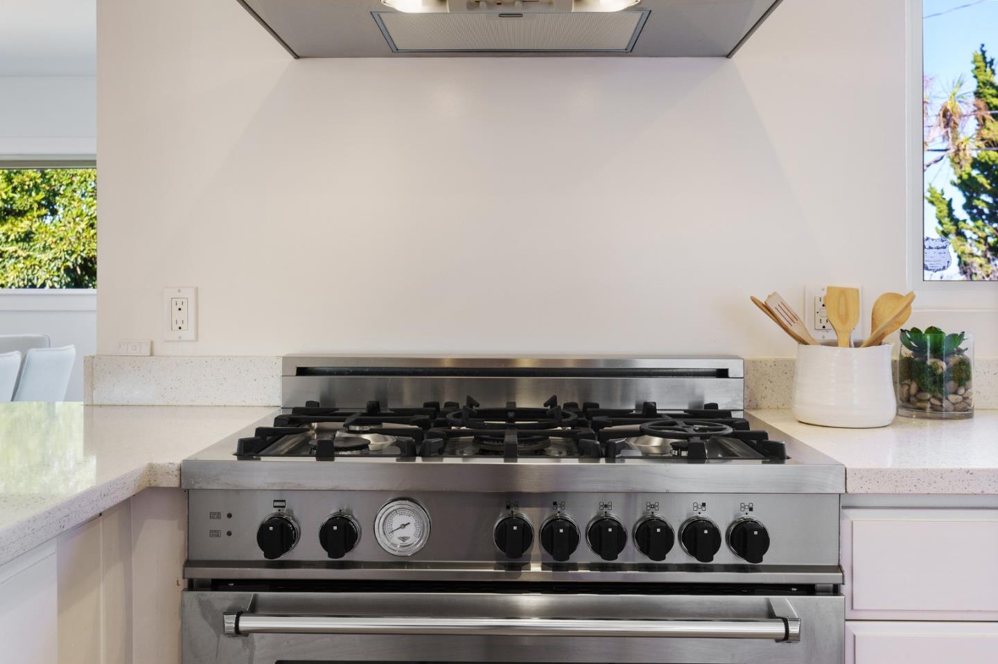 1150 Elmwood Drive Millbrae, CA 94030 - Photo 17 of 46 a stove top oven sitting inside of a kitchen