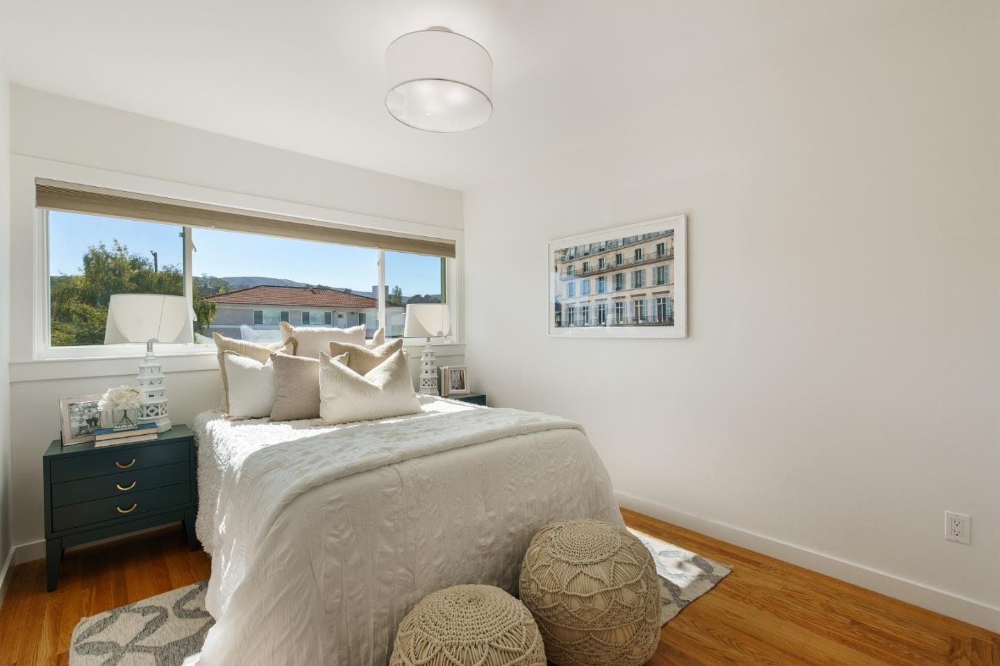 1150 Elmwood Drive Millbrae, CA 94030 - Photo 20 of 46 a bedroom with a bed and wooden floor