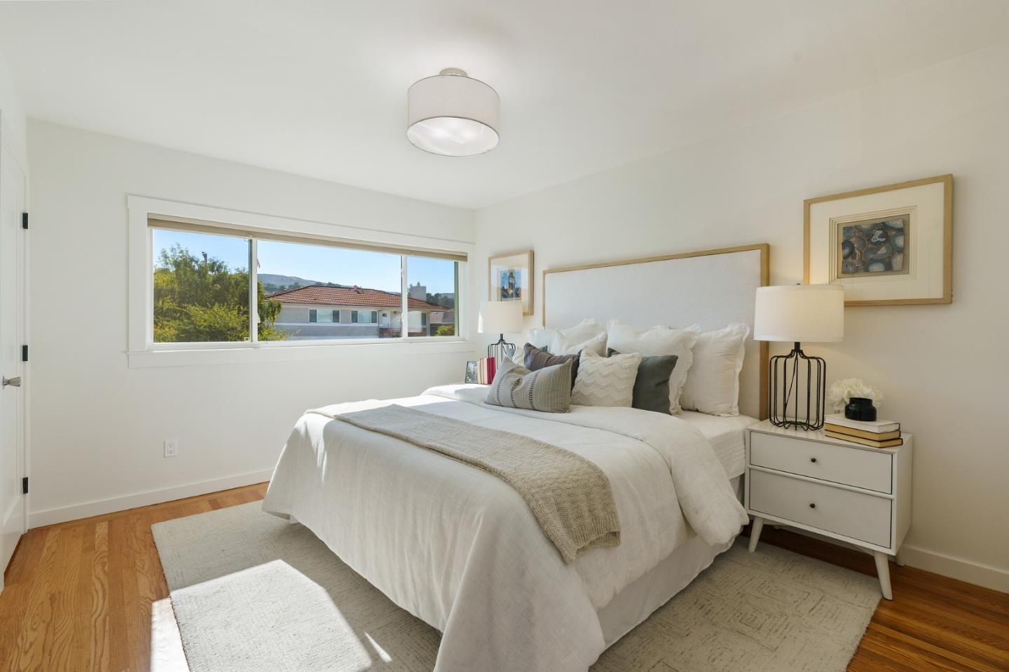 1150 Elmwood Drive Millbrae, CA 94030 - Photo 23 of 46 a bedroom with bed and window