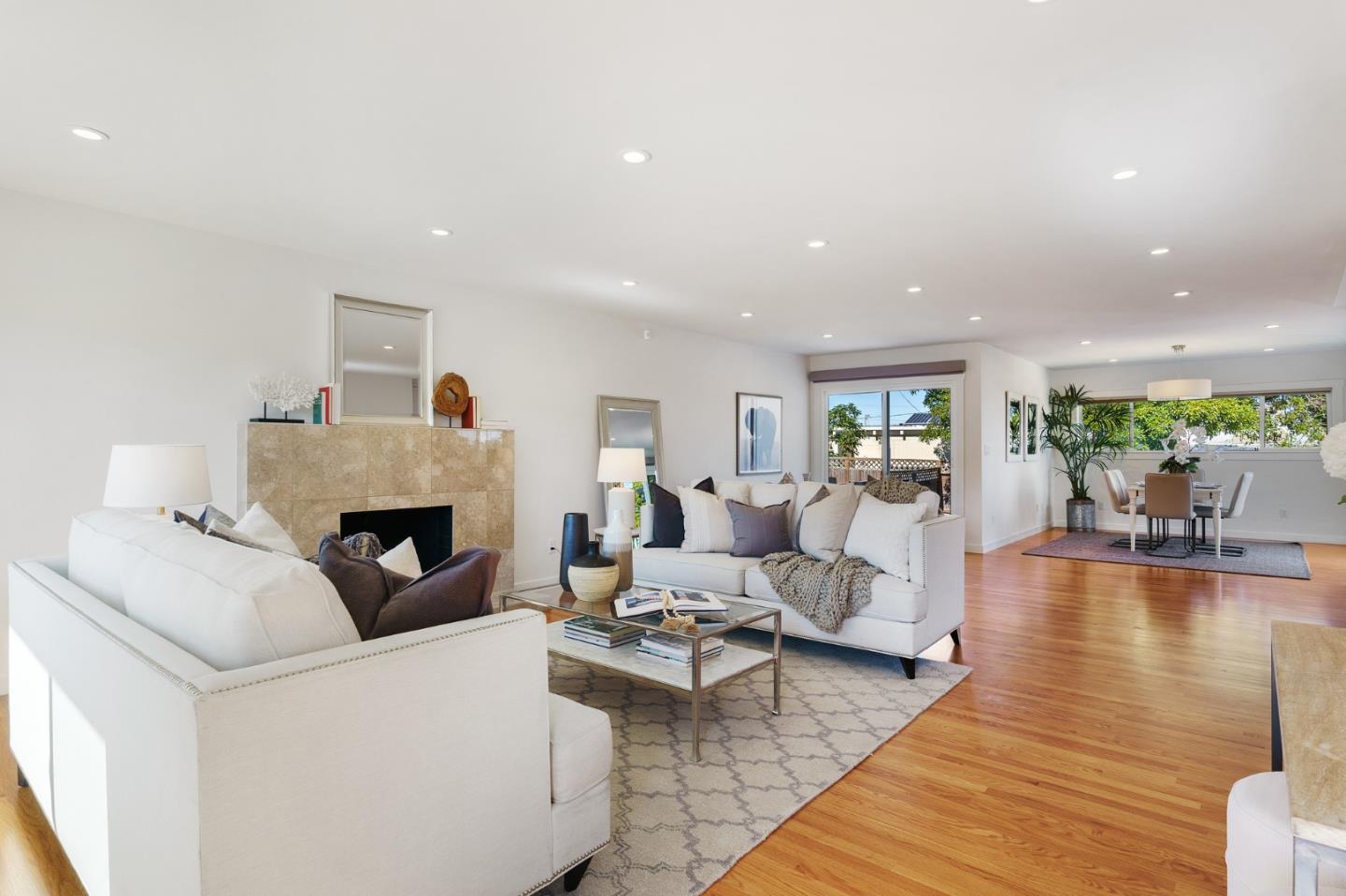 1150 Elmwood Drive Millbrae, CA 94030 - Photo 4 of 46 a living room with furniture and a fireplace
