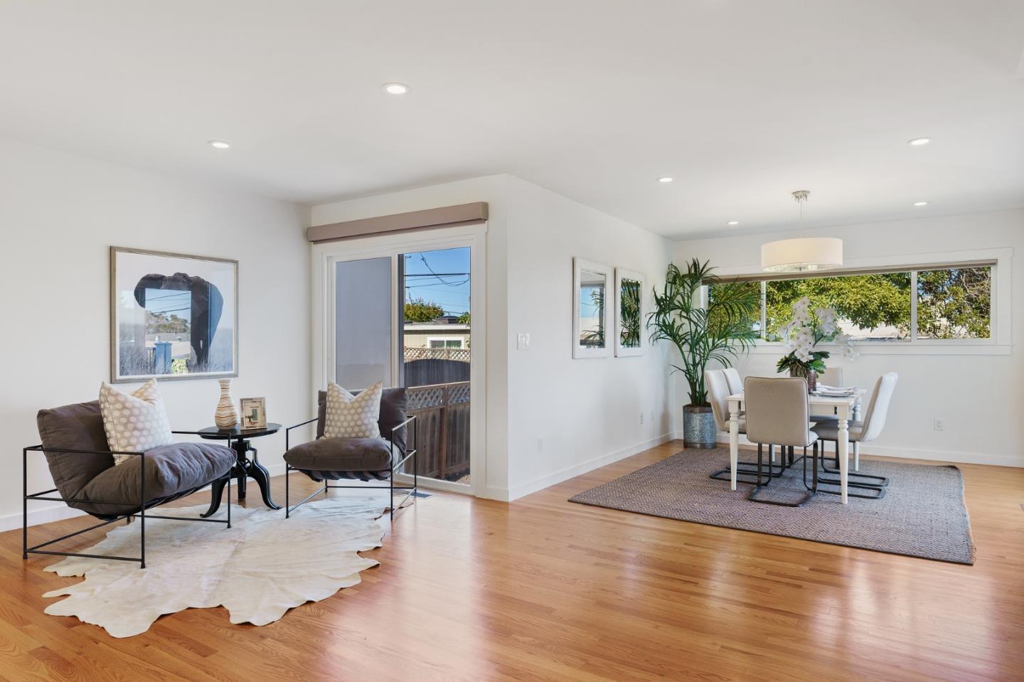 1150 Elmwood Drive Millbrae, CA 94030 - Photo 9 of 46 a living room with furniture and a wooden floor