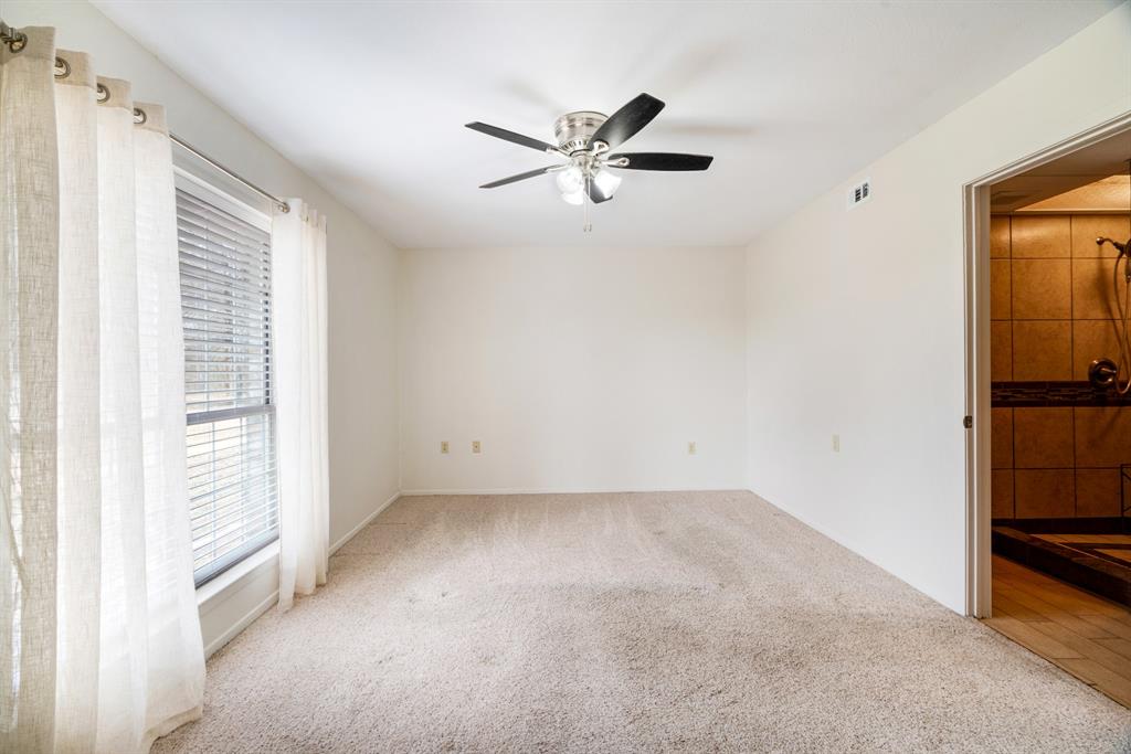 374 County Road Paris, TX 75462 - Photo 14 of 38 a view of empty room with ceiling fan