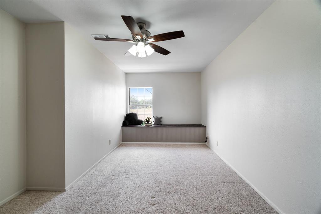 374 County Road Paris, TX 75462 - Photo 19 of 38 a view of empty room with window