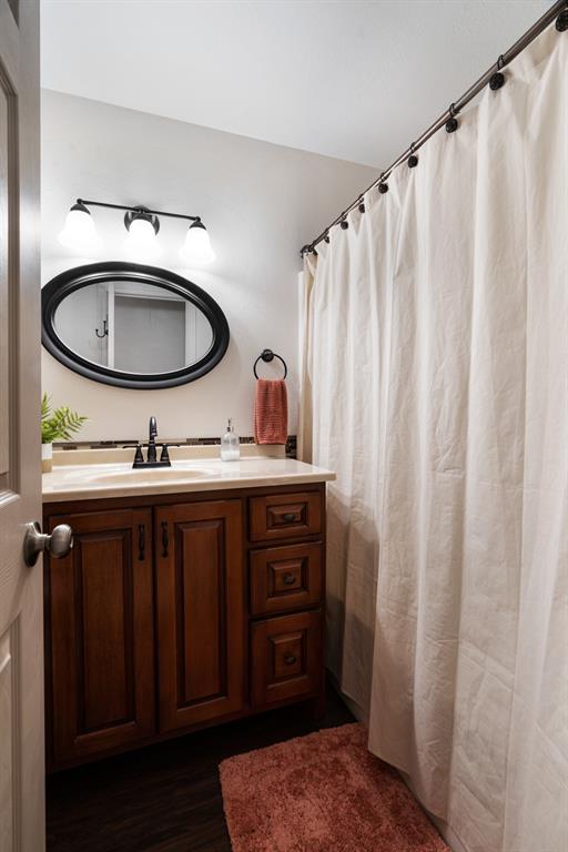 374 County Road Paris, TX 75462 - Photo 20 of 38 a bathroom with a sink and a mirror