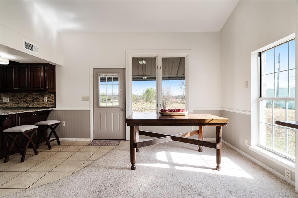374 County Road Paris, TX 75462 - Photo 7 of 38 a view of a workspace with furniture and a window