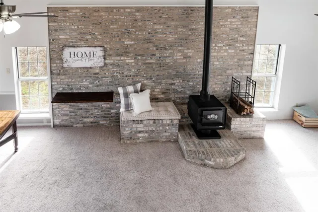 a kitchen with stainless steel appliances granite countertop a sink refrigerator and cabinets