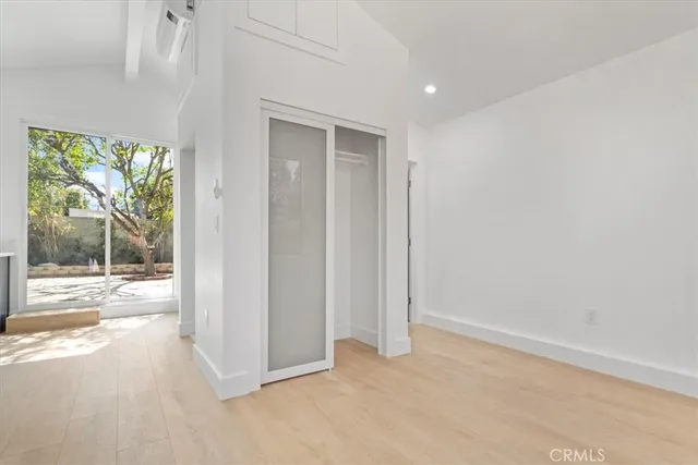 a view of a room with a large window