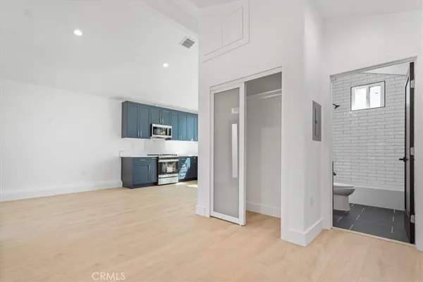 a spacious bathroom with a toilet sink and shower