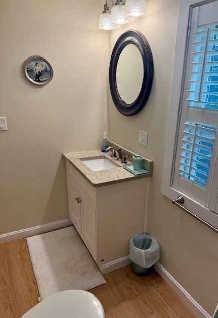 428 Main Street Barnstable, MA 02635 - Photo 11 of 25 a bathroom with a toilet a sink and a mirror
