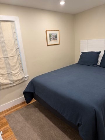 428 Main Street Barnstable, MA 02635 - Photo 14 of 25 a bed sitting in a bedroom next to a window
