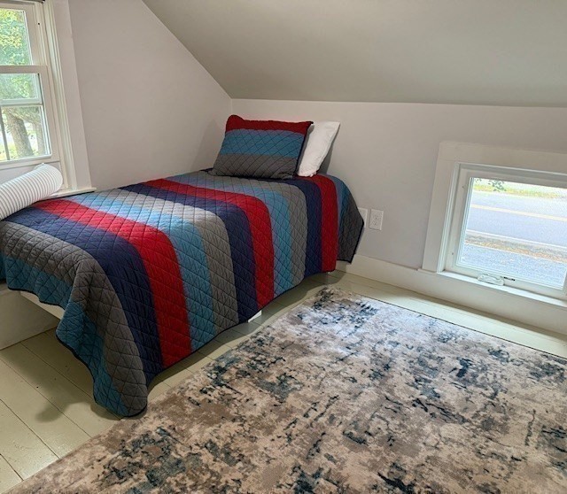 428 Main Street Barnstable, MA 02635 - Photo 15 of 25 a bed sitting in a bedroom next to a window