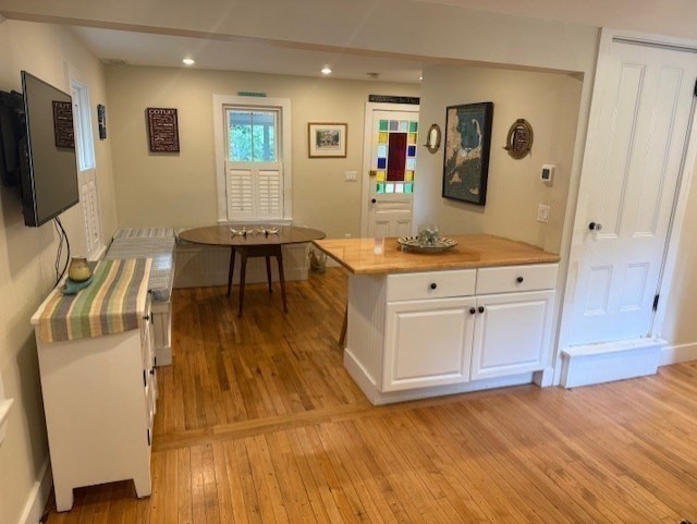 428 Main Street Barnstable, MA 02635 - Photo 3 of 25 a living room with stainless steel appliances kitchen island granite countertop furniture and a flat screen tv