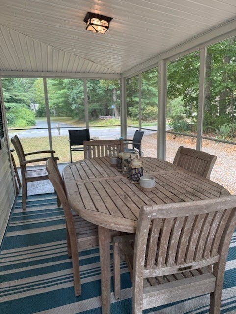 428 Main Street Barnstable, MA 02635 - Photo 8 of 25 a dining room with furniture large windows and wooden floor