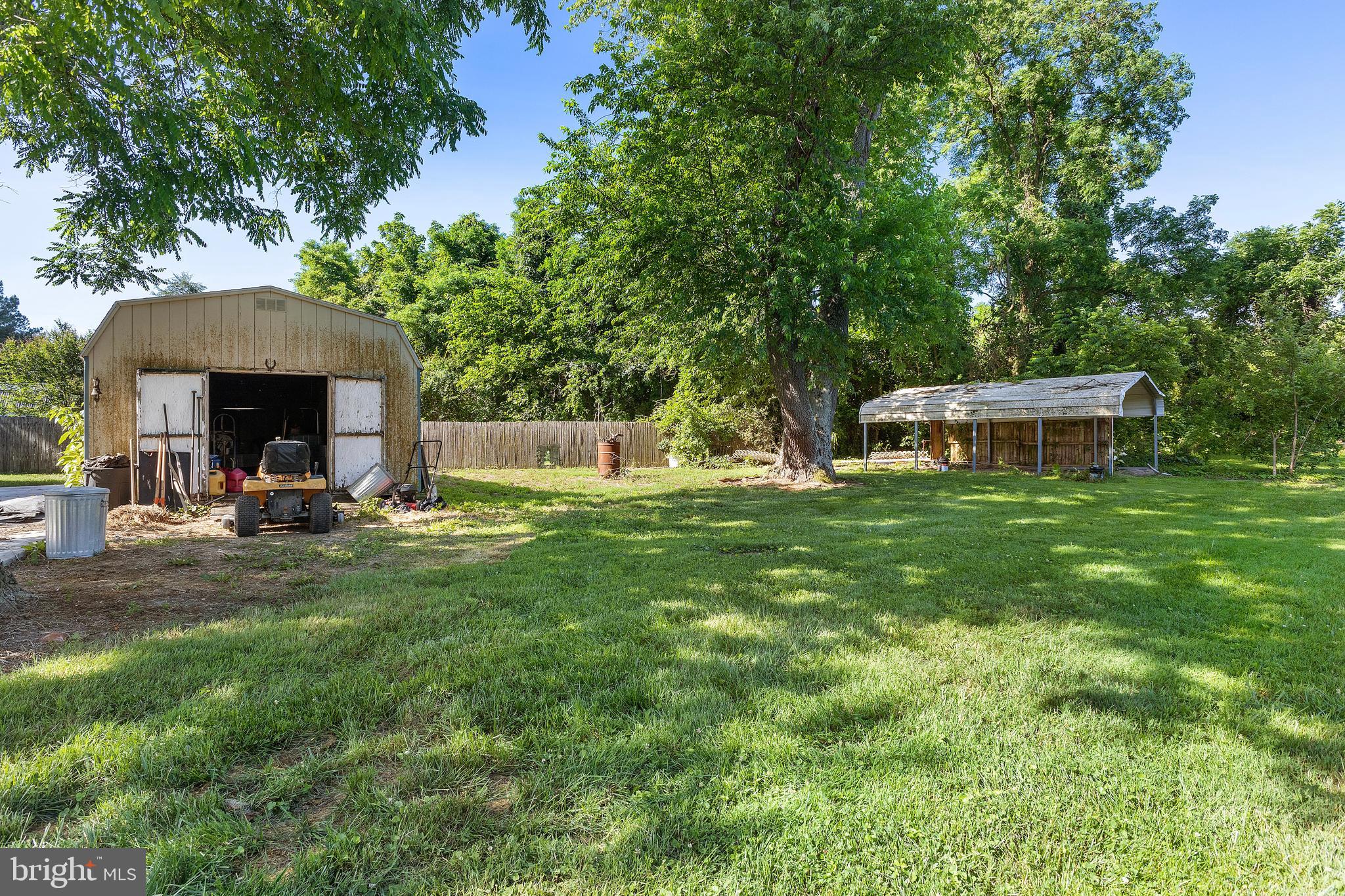 7112 East New Market Ellwood Road Hurlock, MD 21643 - Photo 27 of 41 a view of a house with backyard and sitting area