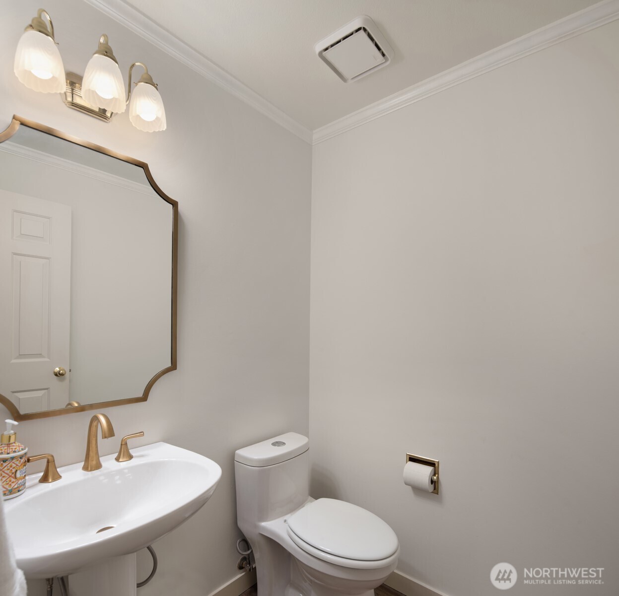 10330 Northeast 151st Place Bothell, WA 98011 - Photo 18 of 38 a bathroom with a toilet a sink and mirror