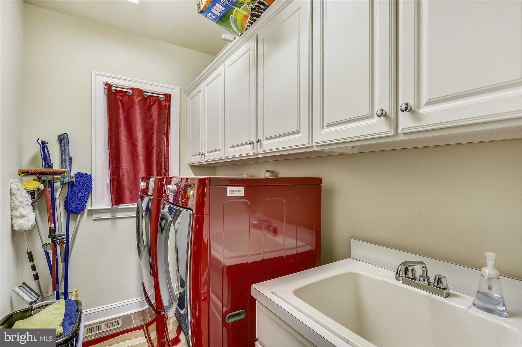 4826 Chichester House Road Olney, MD 20832 - Photo 86 of 97 Laundry room w/cabinets and wash tub