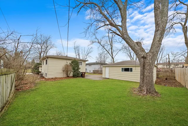 a view of a house with a yard