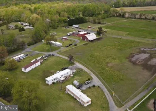 an aerial view of a house with a ocean view