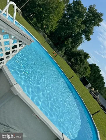 a view of swimming pool from a balcony