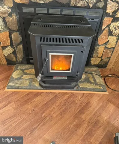 a view of an empty room with a fireplace