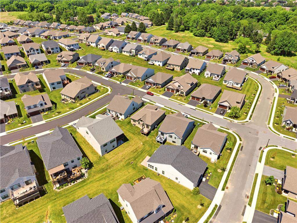 4120 Eveningstar Road Emmaus, PA 18049 - Photo 55 of 62 An aerial perspective reveals a well-planned suburban neighborhood with uniform homes and lush green landscaping.