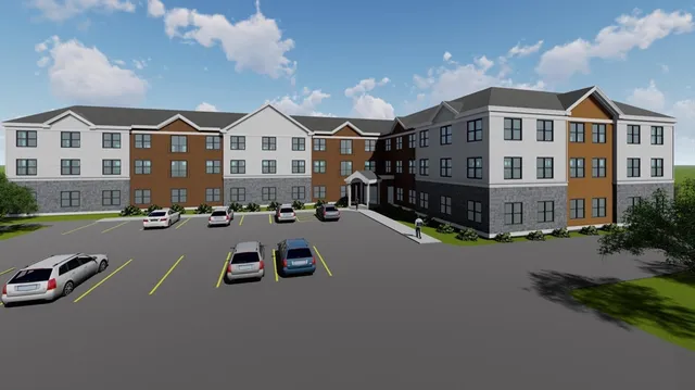 a view of a city street with tall buildings