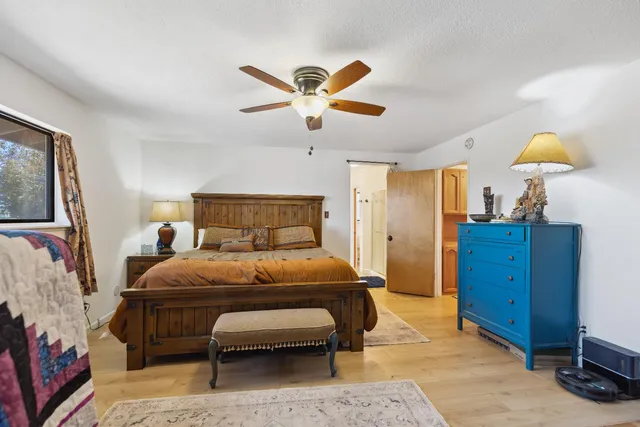 a spacious bathroom with a double vanity sink a mirror and a shower
