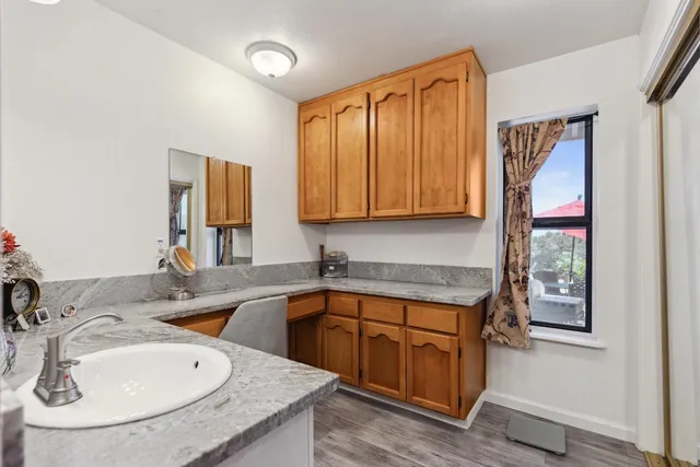 a bathroom with a double vanity sink and a mirror