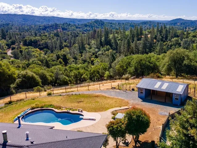 a view of a swimming pool with a patio