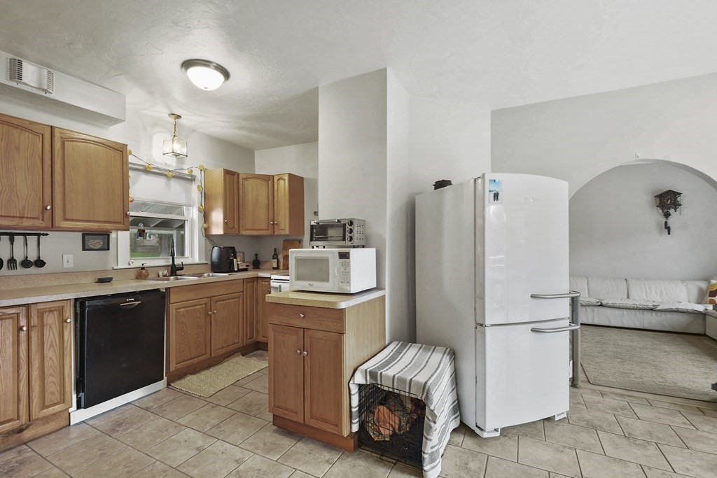 75 Main Street Templeton, MA 01436 - Photo 12 of 33 a kitchen with white cabinets and refrigerator