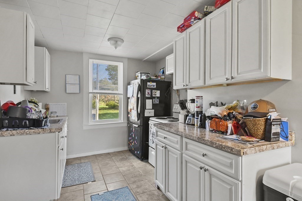 75 Main Street Templeton, MA 01436 - Photo 18 of 33 a kitchen with a refrigerator and window