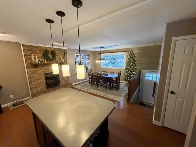 a view of a dining room with furniture and chandelier