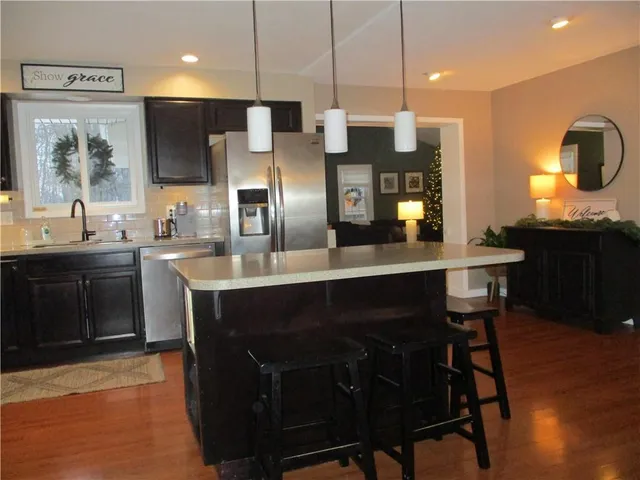 a living room with fireplace furniture and a flat screen tv