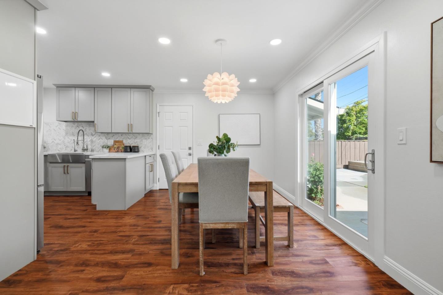 3802 West Rincon Avenue San Jose, CA 95008 - Photo 11 of 26 a view of a dining room with furniture window and wooden floor