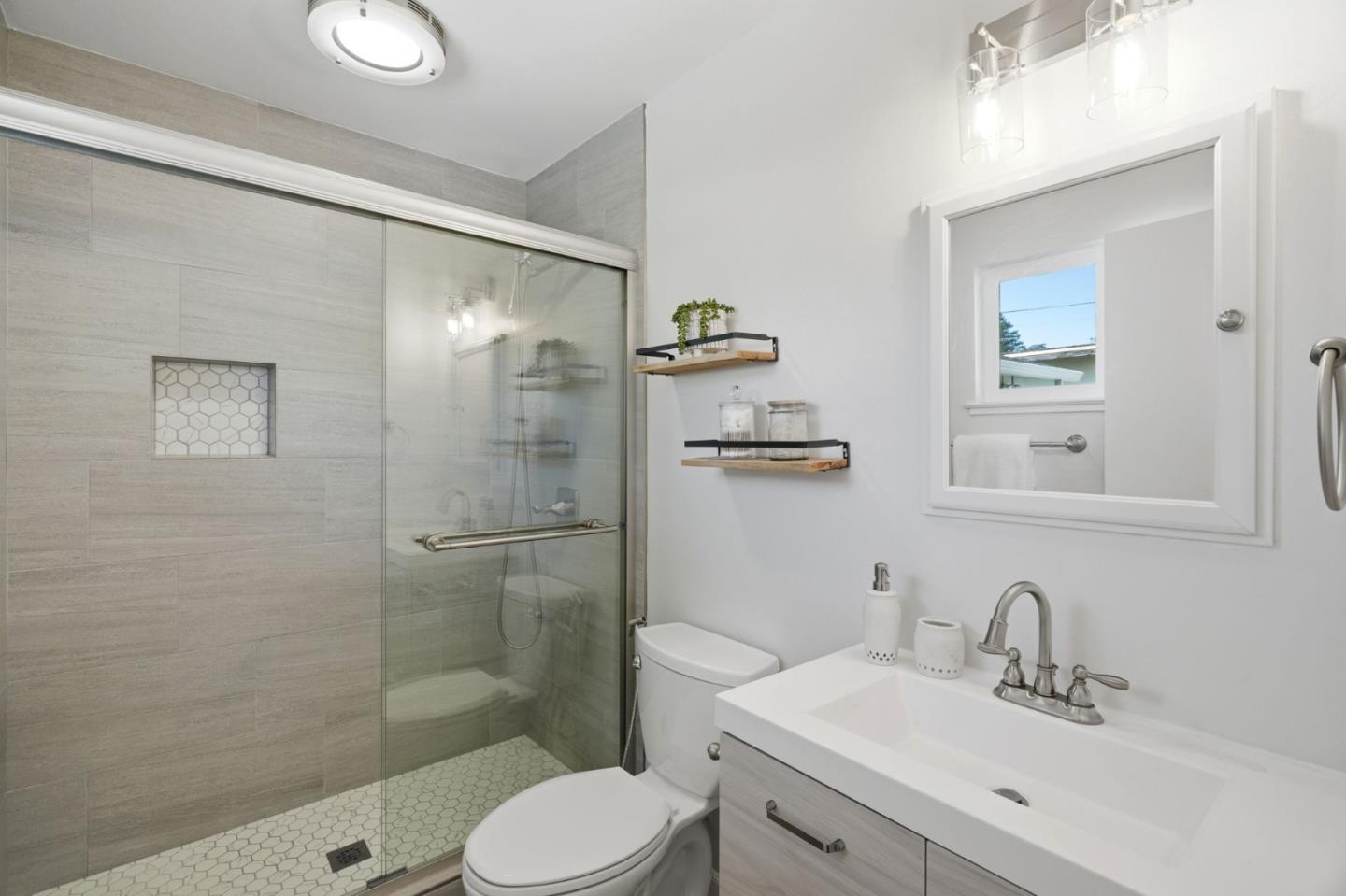 3802 West Rincon Avenue San Jose, CA 95008 - Photo 14 of 26 a bathroom with a sink toilet and shower
