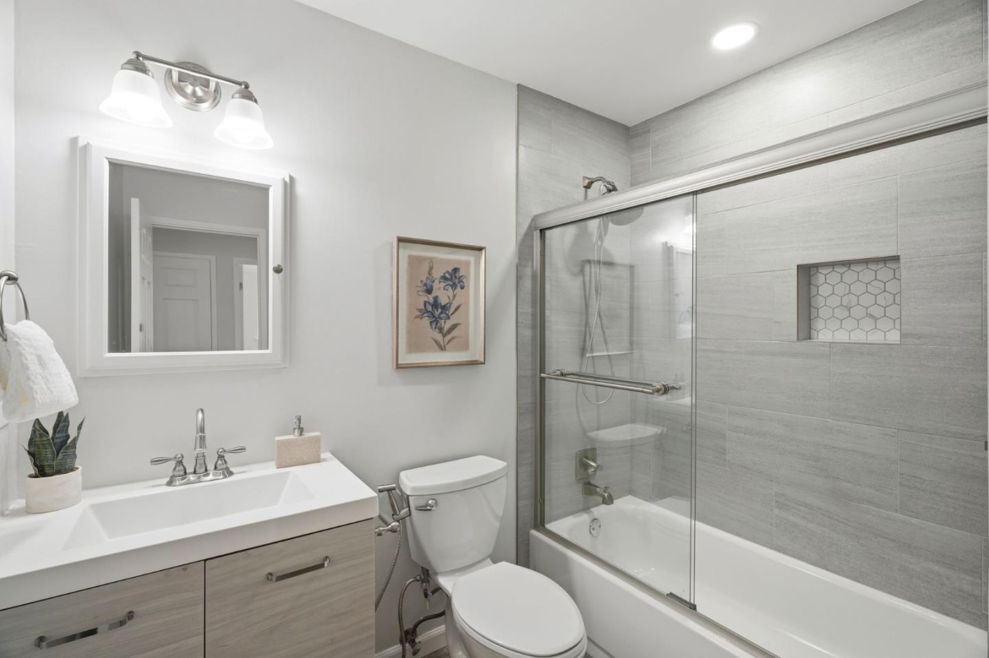3802 West Rincon Avenue San Jose, CA 95008 - Photo 16 of 26 a bathroom with a toilet a sink and shower