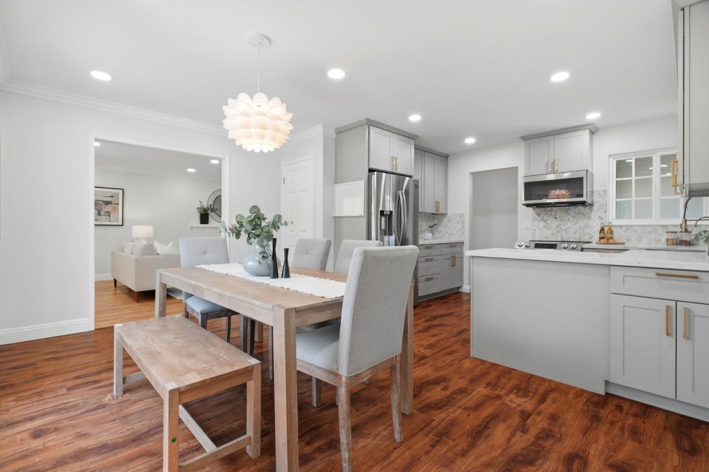 3802 West Rincon Avenue San Jose, CA 95008 - Photo 6 of 26 a view of a dining room with furniture and wooden floor