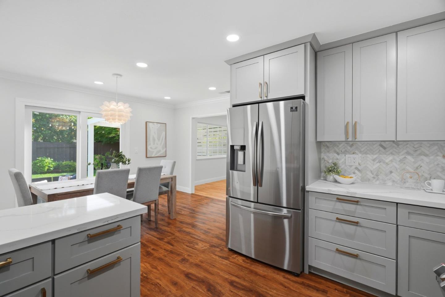 3802 West Rincon Avenue San Jose, CA 95008 - Photo 9 of 26 a kitchen with a refrigerator a sink and cabinets